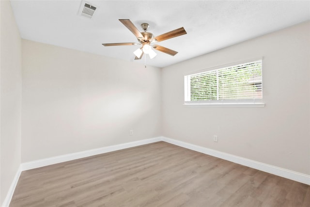 3101 Possum Trot St, Brenham, TX 77833 - empty room featuring light wood-style flooring and a ceiling fan