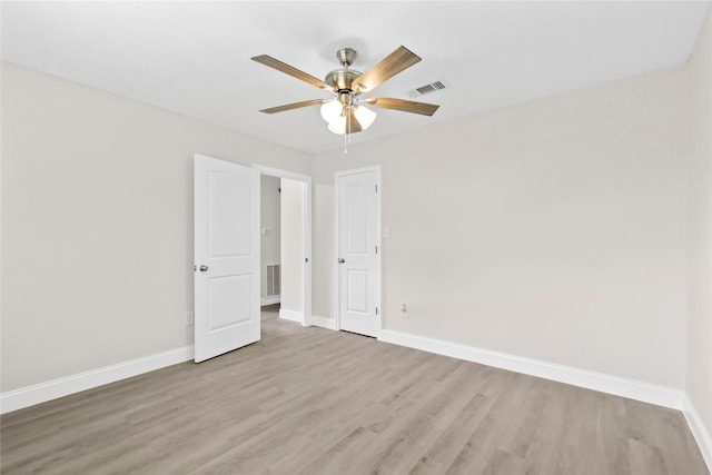 3101 Possum Trot St, Brenham, TX 77833 - unfurnished bedroom with light wood finished floors and a ceiling fan