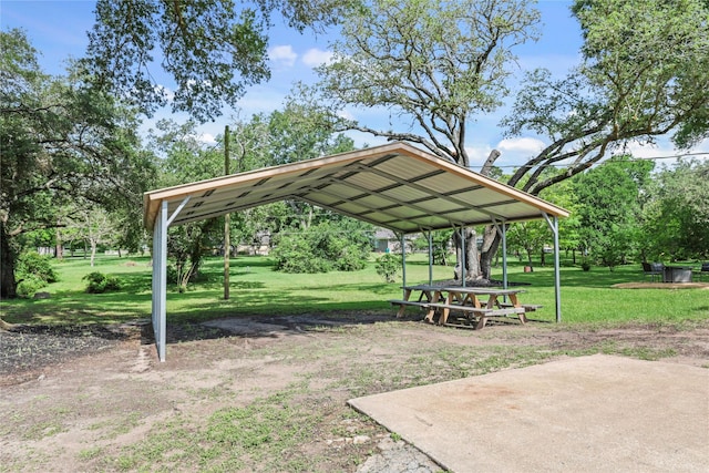 3101 Possum Trot St, Brenham, TX 77833 - view of home's community with a carport, a yard, and driveway