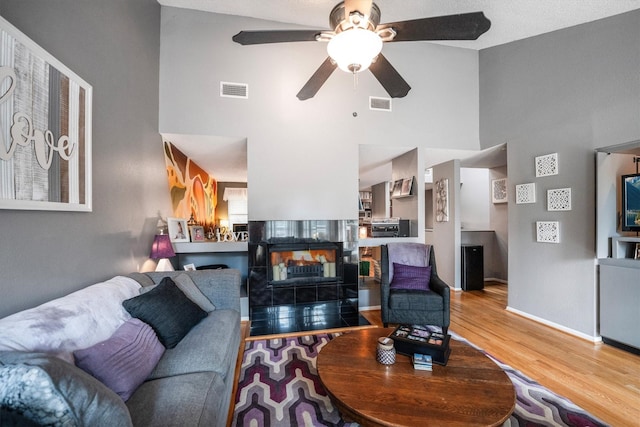 1501 Wimbledon Dr, Huntsville, TX 77340 - living room featuring a high ceiling, ceiling fan, and light wood finished floors