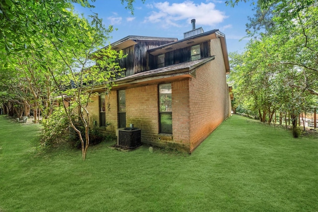 1501 Wimbledon Dr, Huntsville, TX 77340 - rear view of house with brick siding and a yard