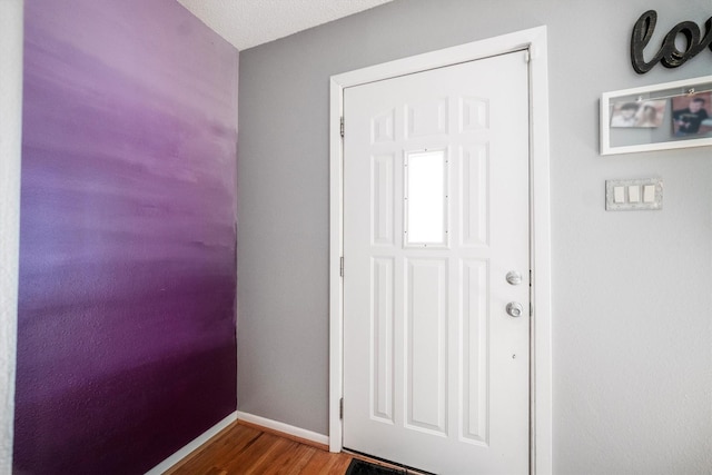 1501 Wimbledon Dr, Huntsville, TX 77340 - doorway featuring wood finished floors and baseboards