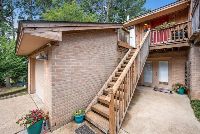 1501 Wimbledon Dr, Huntsville, TX 77340 - property entrance with brick siding, french doors, and a garage