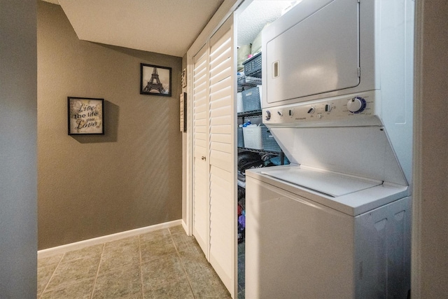 1501 Wimbledon Dr, Huntsville, TX 77340 - laundry area featuring stacked washing machine and dryer and baseboards