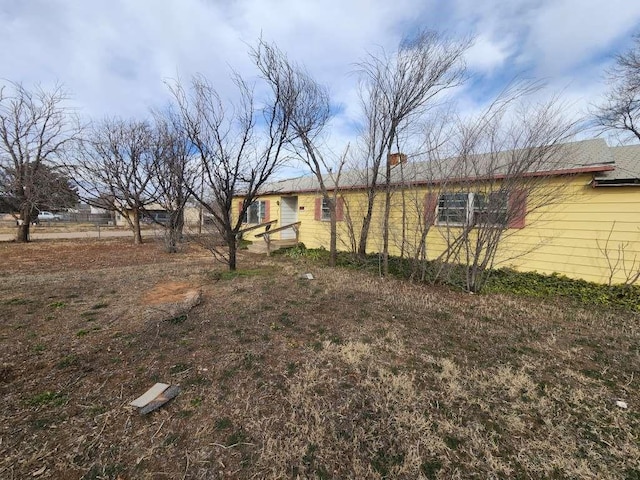 701 E Purdue St, Lubbock, TX 79403 - view of front of home with a chimney