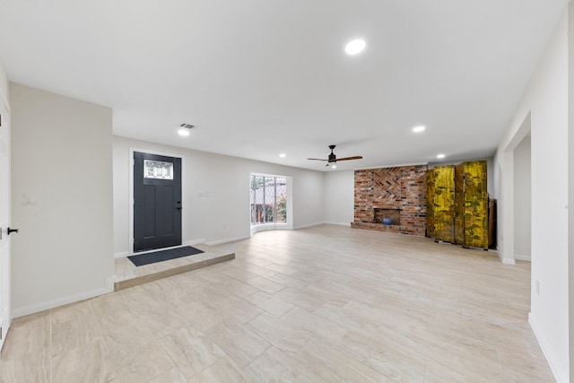 3915 Southmore Cir, Houston, TX 77004 - unfurnished living room with a ceiling fan, recessed lighting, and a brick fireplace
