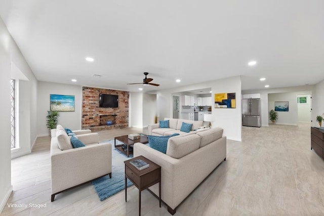 3915 Southmore Cir, Houston, TX 77004 - living room with ceiling fan, light wood-style floors, recessed lighting, and a fireplace