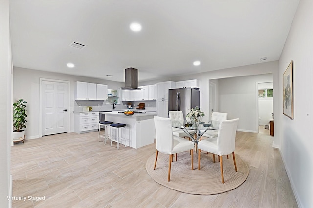 3915 Southmore Cir, Houston, TX 77004 - dining space featuring light wood finished floors and recessed lighting