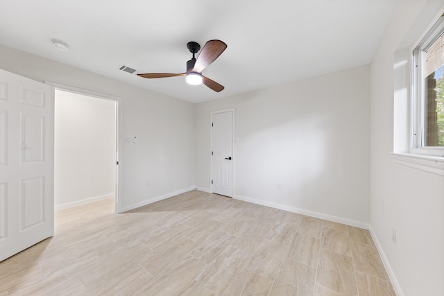 3915 Southmore Cir, Houston, TX 77004 - spare room with a smoke detector, a ceiling fan, and light wood-style flooring