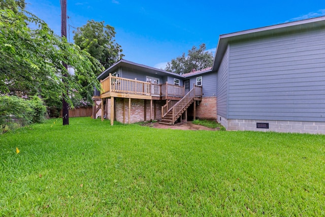 3915 Southmore Cir, Houston, TX 77004 - back of house featuring a deck, crawl space, a lawn, and stairs