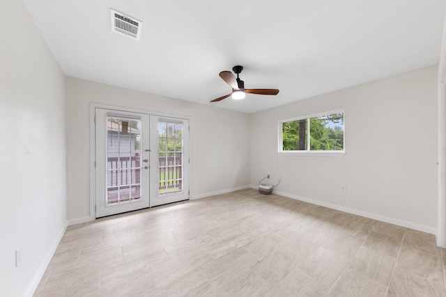 3915 Southmore Cir, Houston, TX 77004 - spare room featuring french doors, healthy amount of natural light, and a ceiling fan