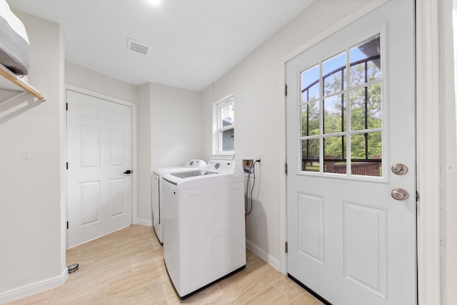 3915 Southmore Cir, Houston, TX 77004 - laundry room with washer and clothes dryer and baseboards