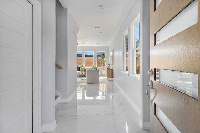 9311 Noel St, Houston, TX 77033 - hallway with light marble finish flooring and baseboards