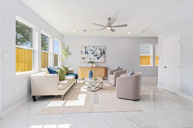 9311 Noel St, Houston, TX 77033 - living room with light marble finish flooring, a ceiling fan, and recessed lighting
