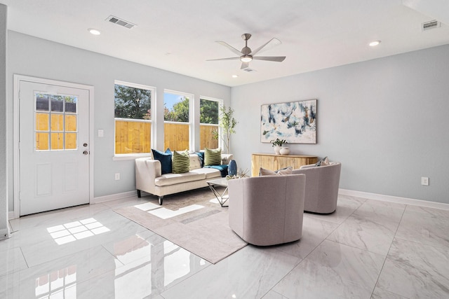 9311 Noel St, Houston, TX 77033 - living room featuring light marble finish flooring, ceiling fan, and recessed lighting