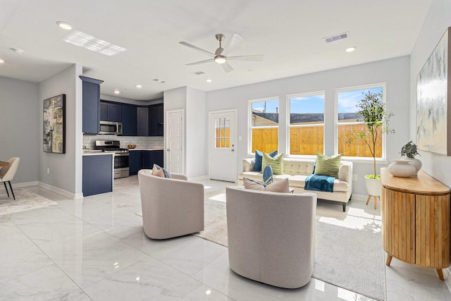 9311 Noel St, Houston, TX 77033 - living area with light marble finish floors, a ceiling fan, and recessed lighting
