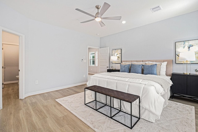 9311 Noel St, Houston, TX 77033 - bedroom featuring light wood-style flooring, recessed lighting, a ceiling fan, and ensuite bathroom