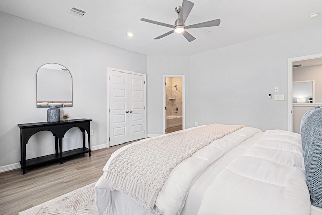 9311 Noel St, Houston, TX 77033 - bedroom with light wood-type flooring, a closet, a ceiling fan, connected bathroom, and recessed lighting
