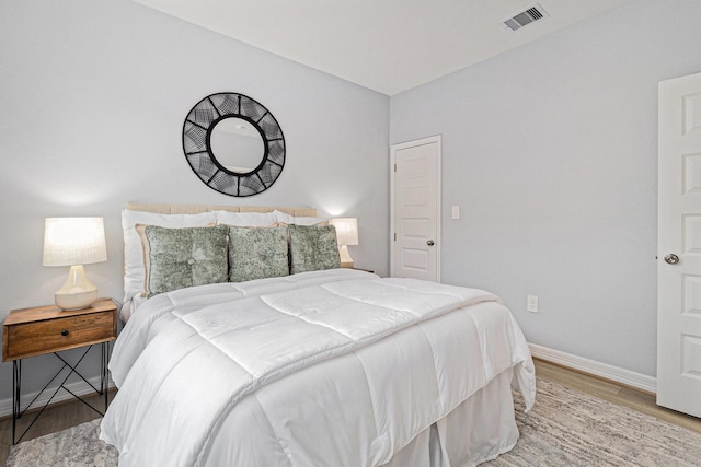 9311 Noel St, Houston, TX 77033 - bedroom featuring baseboards and wood finished floors