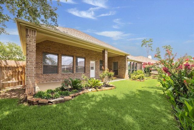 25207 Oak Star Dr, Spring, TX 77389 - rear view of property featuring brick siding and roof with shingles