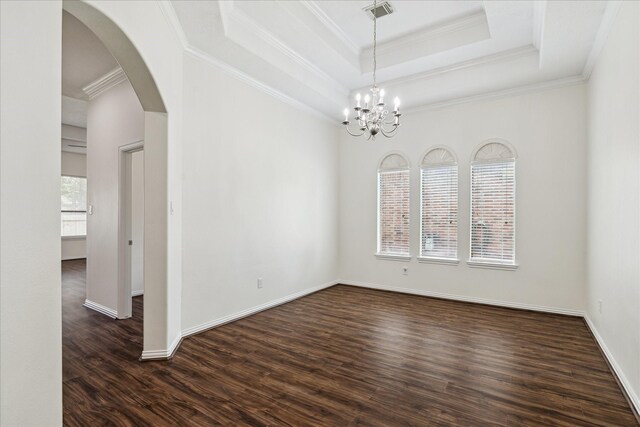 25207 Oak Star Dr, Spring, TX 77389 - unfurnished room featuring dark wood-type flooring, arched walkways, ornamental molding, a chandelier, and a raised ceiling