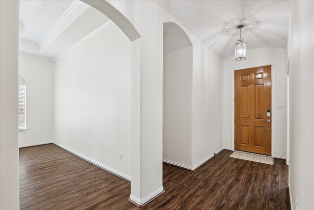 25207 Oak Star Dr, Spring, TX 77389 - foyer featuring dark wood-style floors, ornamental molding, and arched walkways