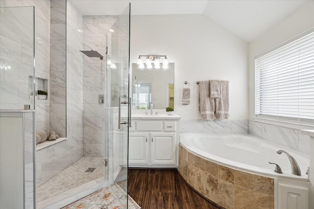 25207 Oak Star Dr, Spring, TX 77389 - full bath with vanity, a bath, a shower stall, wood finished floors, and vaulted ceiling