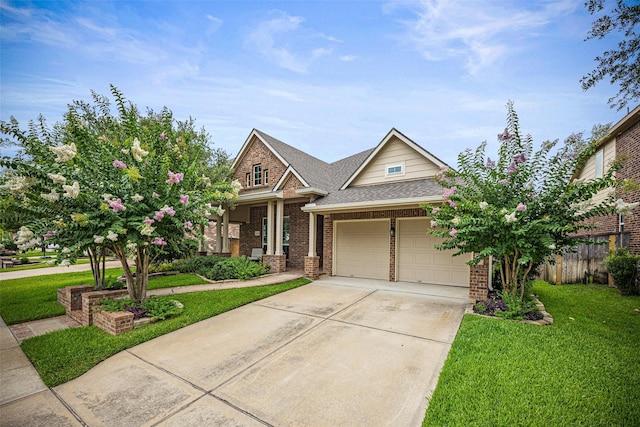 12314 Meadow Blossom Ln, Cypress, TX 77433 - view of front of house featuring brick siding, a garage, driveway, and a shingled roof