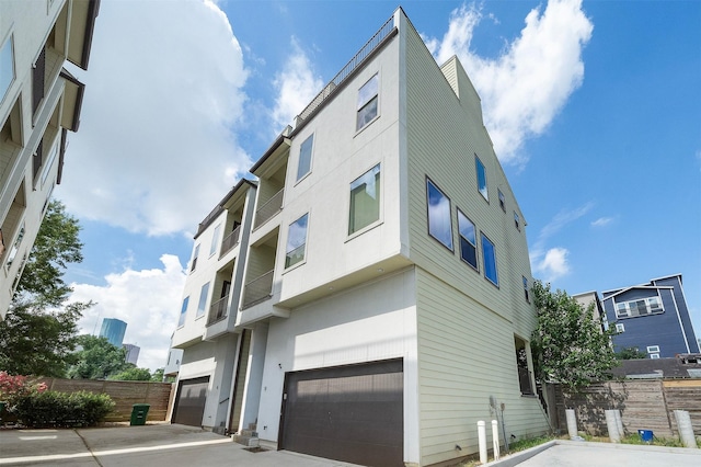 1005 Bingham St Unit 5, Houston, TX 77007 - view of building exterior featuring an attached garage