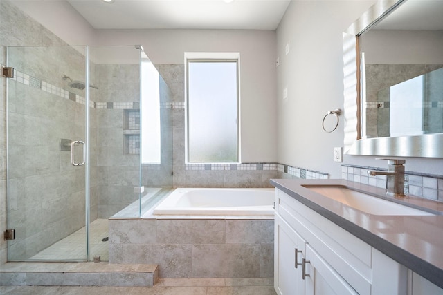 1005 Bingham St Unit 5, Houston, TX 77007 - bathroom featuring healthy amount of natural light, a bath, vanity, and a stall shower