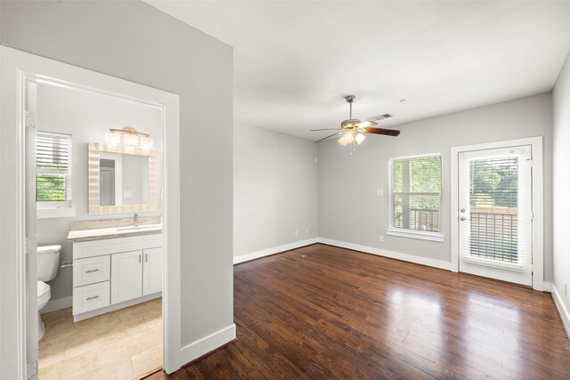 1005 Bingham St Unit 5, Houston, TX 77007 - empty room with plenty of natural light, a ceiling fan, and light wood-type flooring