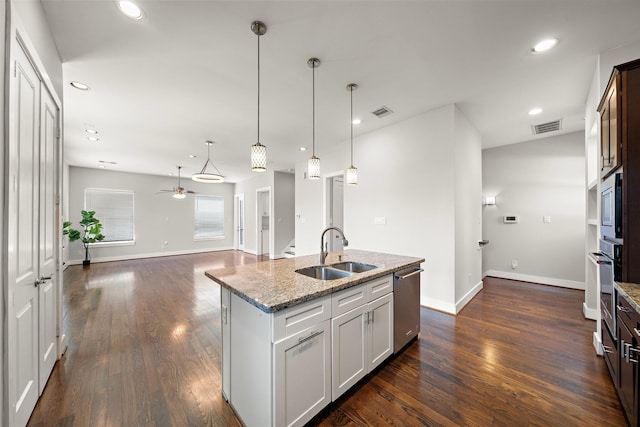 1005 Bingham St Unit 5, Houston, TX 77007 - kitchen featuring appliances with stainless steel finishes, ceiling fan, light stone countertops, dark wood-type flooring, and recessed lighting