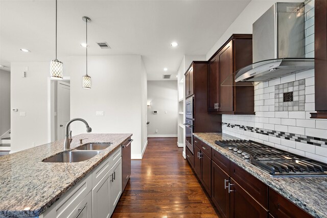 1005 Bingham St Unit 5, Houston, TX 77007 - kitchen featuring stainless steel appliances, wall chimney exhaust hood, light stone counters, tasteful backsplash, and recessed lighting