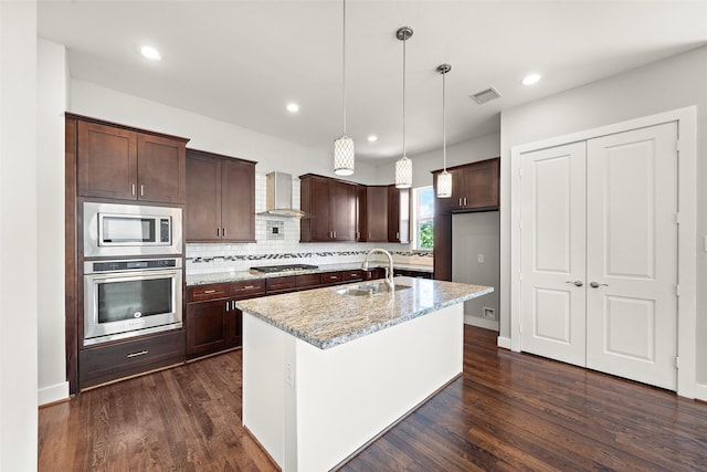 1005 Bingham St Unit 5, Houston, TX 77007 - kitchen featuring stainless steel appliances, wall chimney exhaust hood, dark wood-style flooring, dark brown cabinetry, and decorative backsplash