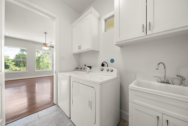 1005 Bingham St Unit 5, Houston, TX 77007 - laundry area with cabinet space, washing machine and clothes dryer, a ceiling fan, and light tile patterned floors