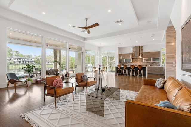 18 Pronghorn Pl, The Woodlands, TX 77389 - living area featuring a ceiling fan, light wood-type flooring, a raised ceiling, and recessed lighting