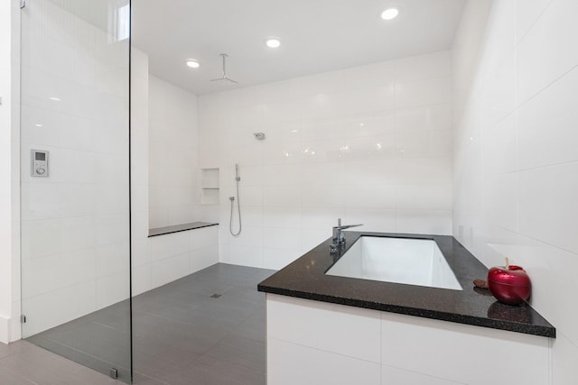 18 Pronghorn Pl, The Woodlands, TX 77389 - full bathroom featuring walk in shower, tile walls, recessed lighting, and vanity
