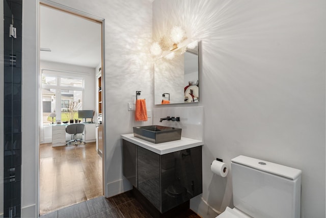 18 Pronghorn Pl, The Woodlands, TX 77389 - bathroom with wood finished floors and vanity