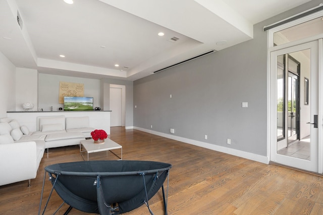 18 Pronghorn Pl, The Woodlands, TX 77389 - living room with wood finished floors, recessed lighting, and a tray ceiling