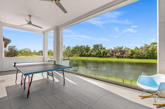 18 Pronghorn Pl, The Woodlands, TX 77389 - view of patio featuring a water view, ceiling fan, and view of wooded area