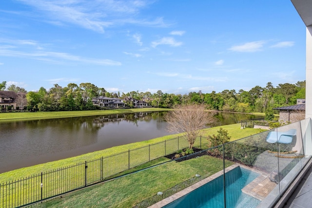18 Pronghorn Pl, The Woodlands, TX 77389 - view of swimming pool featuring a water view and a fenced backyard
