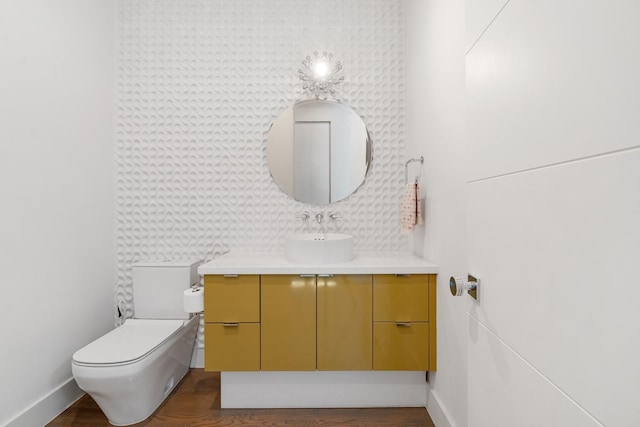 18 Pronghorn Pl, The Woodlands, TX 77389 - half bathroom with vanity and wood finished floors