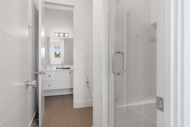 18 Pronghorn Pl, The Woodlands, TX 77389 - full bathroom featuring vanity, a stall shower, and tile patterned floors