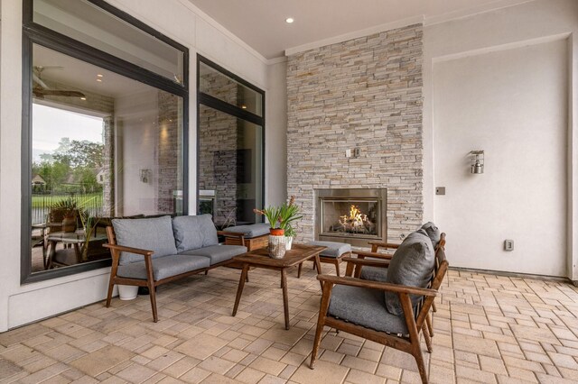 18 Pronghorn Pl, The Woodlands, TX 77389 - view of patio featuring an outdoor living space with a fireplace