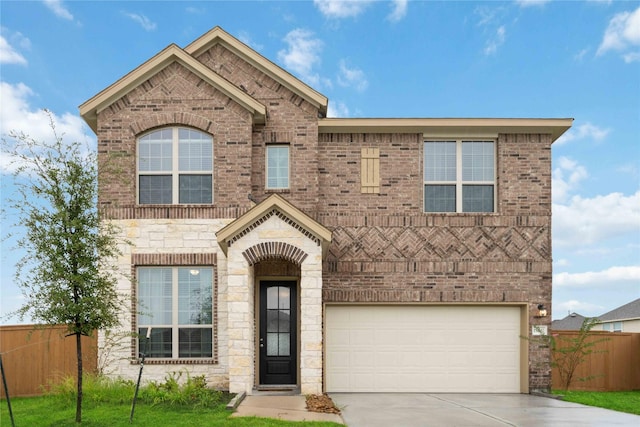 13402 Rain Lily, Texas City, TX 77568 - view of front of house with concrete driveway, an attached garage, brick siding, and stone siding