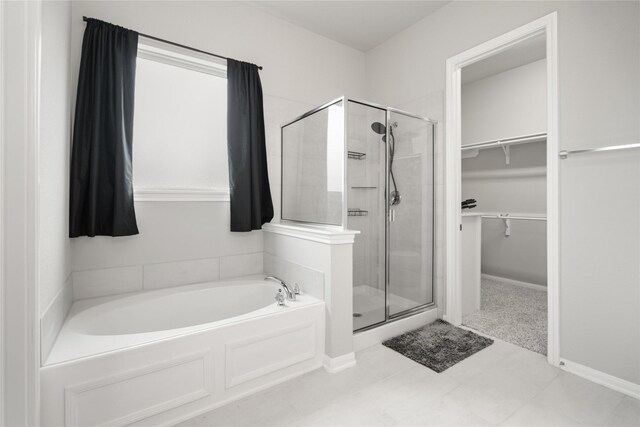 13402 Rain Lily, Texas City, TX 77568 - full bathroom with a bath, a stall shower, and a walk in closet