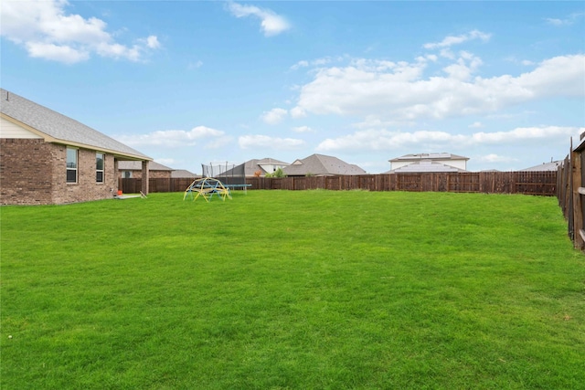 13402 Rain Lily, Texas City, TX 77568 - fenced backyard with a playground and a trampoline
