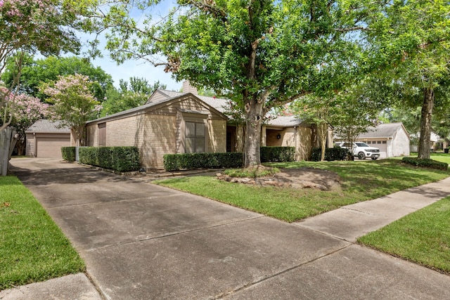 1406 Diana Ct, Houston, TX 77062 - mid-century home featuring a front yard, brick siding, and a garage