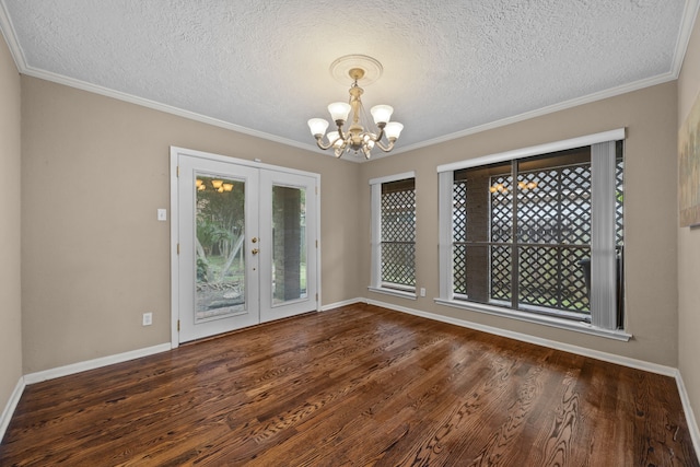 1406 Diana Ct, Houston, TX 77062 - unfurnished dining area with a chandelier, french doors, a textured ceiling, wood finished floors, and crown molding