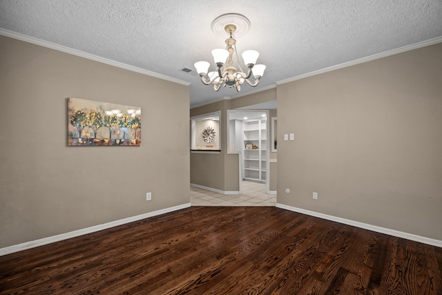 1406 Diana Ct, Houston, TX 77062 - empty room featuring a chandelier, wood finished floors, a textured ceiling, and ornamental molding